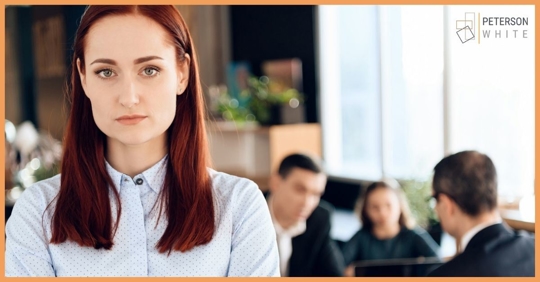 Portrait of a mother with her ex and child talking to an attorney in the background